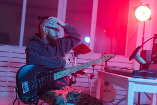 Musician and making music concept - Male sound producer working in recording studio
