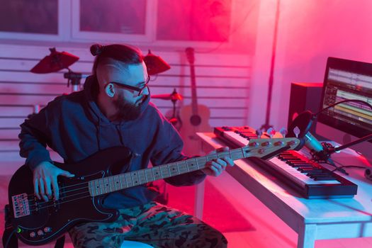 Musician and making music concept - Male sound producer working in recording studio