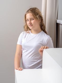 Studio portrait of a schoolgirl girl close-up. The concept of advertising, magazine publications.