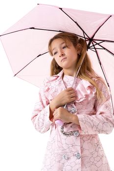 Beautiful girl walking under an umbrella, smiling girl posing in the studio, cheerful teenager in stylish clothes walking on a white background