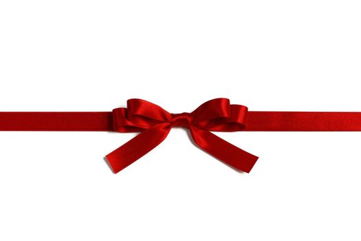 Big red satin bow isolated on white background. Christmas holiday gift concept