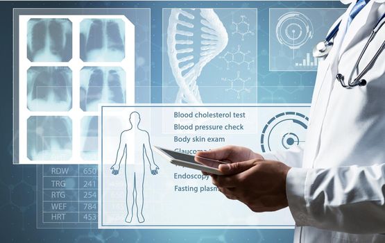 The doctor works with a computer tablet. Digital Medicine Concept