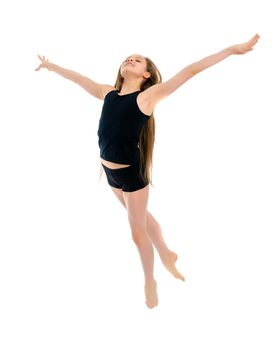 A little girl gymnast joyfully jumps and wags her hands. The concept of sport and fitness. Isolated over white background