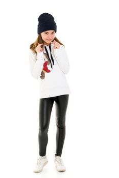 Portrait of a gymnast girl in a tracksuit. Isolated on white background