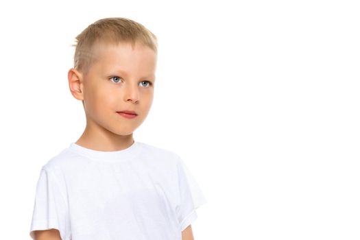 A cute little boy in a white T-shirt. The concept of promotional goods, inscriptions and drawings on clothes. Isolated on white background.