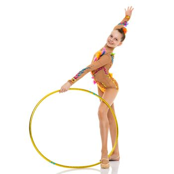 A girl gymnast performs an exercise with a hoop. The concept of gymnastics and fitness. Isolated on white background.