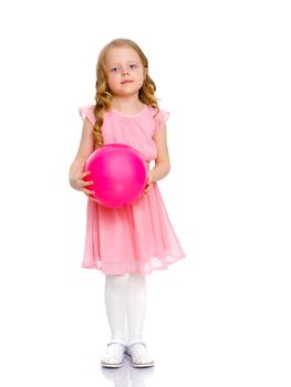 A charming little girl is engaged in fitness with a ball. The concept of gymnastics, health and sports. Isolated on white background.