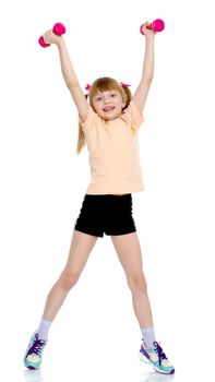 A cute little girl doing exercises with dumbbells. The concept of strength, health and sport. Isolated on white background.