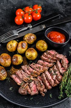 Grilled marble meat beef Steak with fried potato. Black background. Top view.