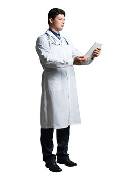 young doctor with a tablet computer, in a white medical coat and with a stethoscope