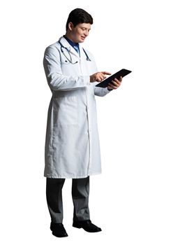 young doctor with a tablet computer, in a white medical coat and with a stethoscope