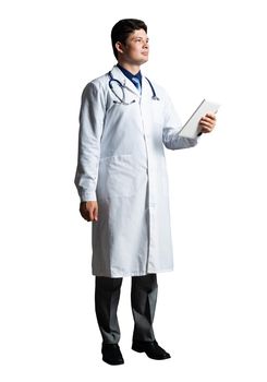 young doctor with a tablet computer, in a white medical coat and with a stethoscope