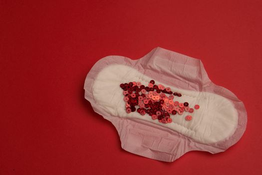 feminine pad blood menstruation hygiene red background. High quality photo