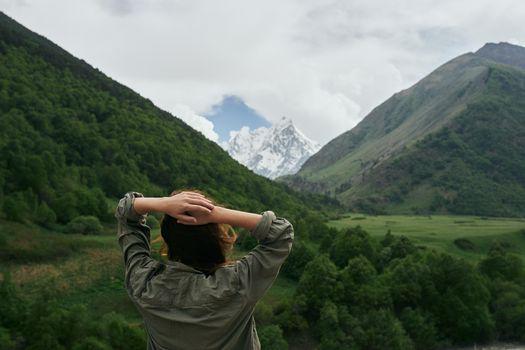 woman hiker nature mountains landscape fresh air. High quality photo