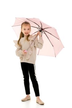 Beautiful little girl with umbrella. Concept of weather, climate change. Isolated on white background