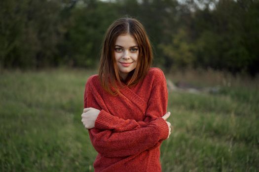 woman red sweater cool air nature romance. High quality photo