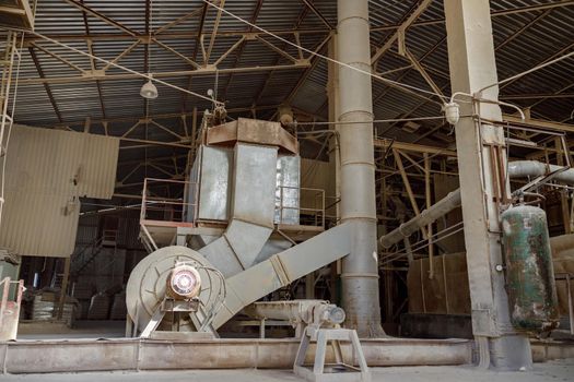 Section of manufacturing plant with industrial building, production facilities and equipment