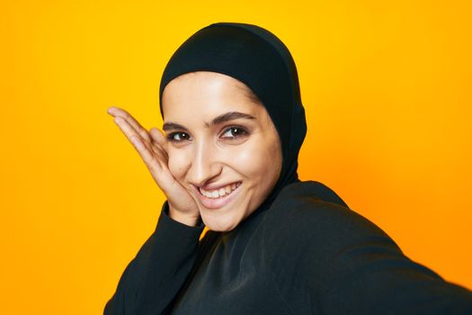 cheerful woman fun ethnicity model posing emotions yellow background. High quality photo
