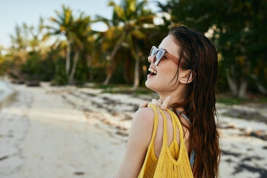 woman wearing sunglasses blue swimsuit island beach sun. High quality photo