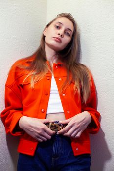 young pretty woman with blond hair on white background, sensual makeup, fashion look, lifestyle people concept close up