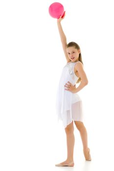 Beautiful little girl gymnast performs exercises with the ball. The concept of children's sports, fitness. Isolated on white background.