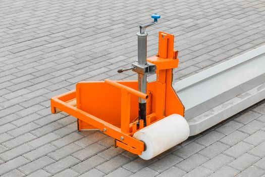 Part of industrial equipment for leveling hard-surfaced surfaces against the background of paving stone tiled slabs. Removes fine sand, grit and various substrates.