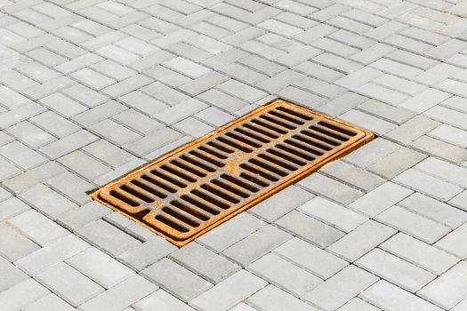 Sewer urban manhole for draining street water underground in sewage.