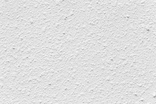 White light plaster surface cement wall facade building abstract concrete texture stucco pattern background.