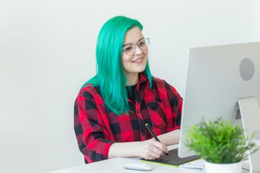 Creative, illustrator, graphic and people concept - Creative businessman writing or drawing on graphic tablet while using laptop in office