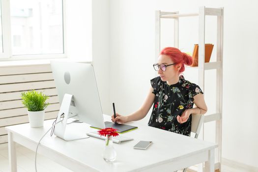 Creative, illustrator, graphic and people concept - Creative businessman writing or drawing on graphic tablet while using laptop in office