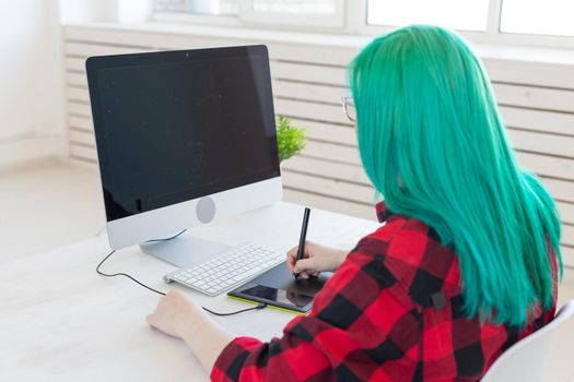 Illustrator, creative, web design concept - Female graphic designer at work.