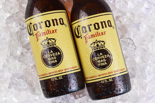 IRVINE, CALIFORNIA - MARCH 21, 2018: Two Corona Familiar beer bottles on ice. Familiar tastes like Corona Extra, but with a richer flavor. 
