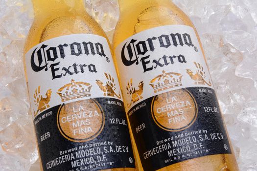 IRVINE, CA - MAY 27, 2014: Two bottles of Corona Extra Beer on a bed of ice. Corona from Grupo Modelo, Anheuser-Busch InBev is the most popular imported beer in the US.