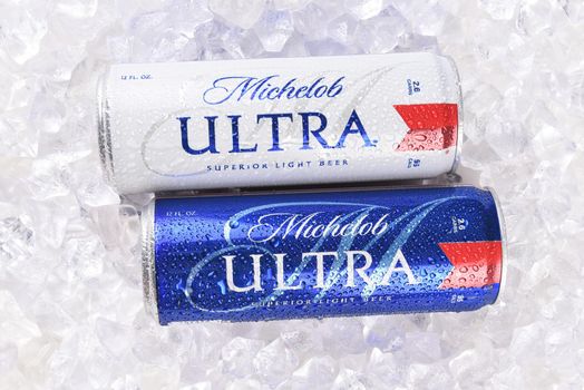 IRVINE, CA - AUGUST 6, 2018: Two Michelob Ultra beer 12 ounce cans in ice. A a low carb and low calorie light beer from Anheuser-Busch. 