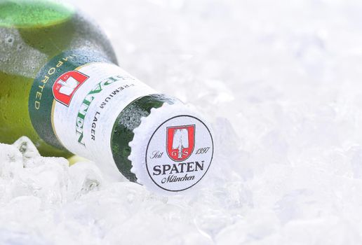 IRVINE, CA - AUGUST 26, 2016: A bottle of Spaten Lager on a bed of ice. The Spaten-Franziskaner-Brau GmbH is a brewery in Munich, Germany.