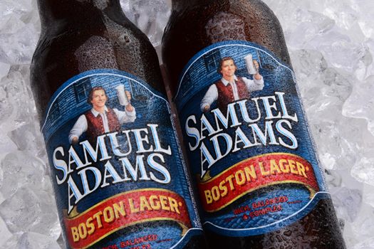 IRVINE, CA - MAY 25, 2014: Two bottles of Samuel Adams Boston Lager on a bed of ice. Brewed by the Boston Beer Company one of the largest American-owned beermakers.