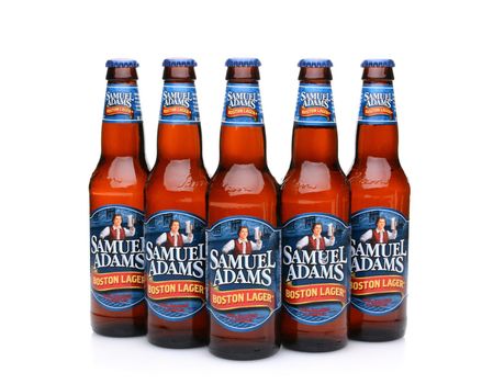 IRVINE, CA - MAY 25, 2014: Five bottles of Samuel Adams Boston Lager on white. Brewed by the Boston Beer Company one of the largest American-owned beermakers.