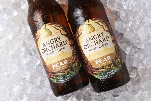 IRVINE, CALIFORNIA - OCTOBER 19, 2018: Two Bottles of Angry Orchard Pear Hard Cider on a bed of ice.