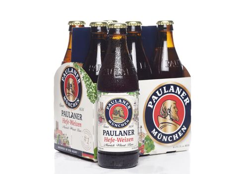IRVINE, CALIFORNIA - 29 NOV 2020: Side, End shot of a 6 pack of Paulaner Hefe-Weizen Beer with a bottle outside the carrier, from Bavaria, Germany.