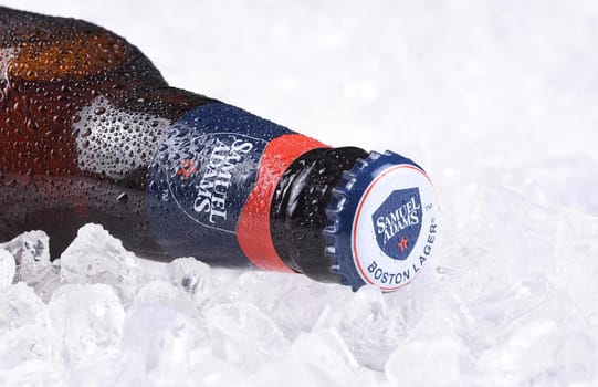 IRVINE, CA - JULY 16, 2017: Samuel Adams beer bottle closeup on ice. From the Boston Beer Company. Based on sales in 2016, it is the second largest craft brewery in the U.S.