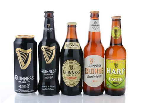 IRVINE, CA - JANUARY, 11, 2015: Five bottles of beer from the Guinness Brewing Company.  Guinness has been producing beer in Ireland since 1759.