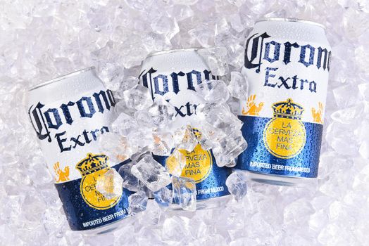 IRVINE, CALIFORNIA - MARCH 29, 2018: Corona Extra beer cans in ice. Corona is the most popular import in the USA.