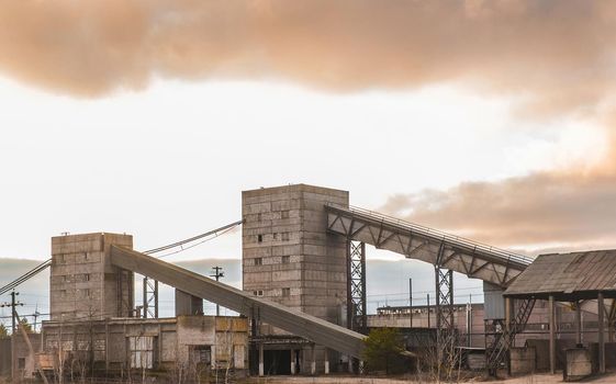 Conveyor belt tower for storing and protecting feed, grain or cement from exposure to water and air. Silo industry, manufacturing, storage tanks on agriculture industrial plant.