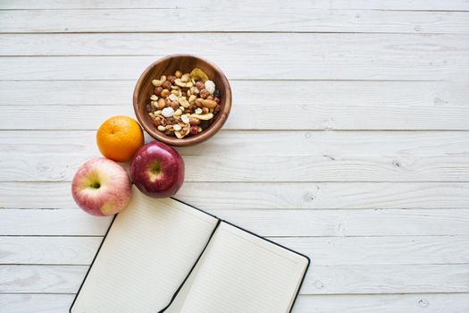 fruit cereals proper nutrition notepad breakfast diet top view. High quality photo