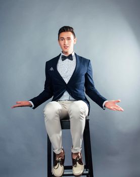 young pretty businessman posing emotional gesturing on white background, lifestyle people concept close up