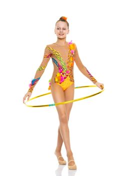 A girl gymnast performs an exercise with a hoop. The concept of gymnastics and fitness. Isolated on white background.