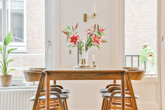 Lovely cozy dining room with wooden furniture