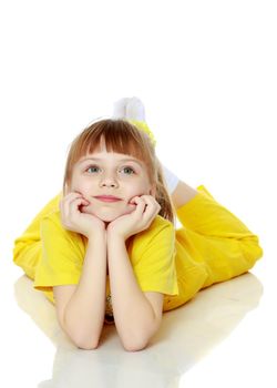 Girl with a short bangs on her head and bright yellow overalls.She crouched down on the white advertising banner.