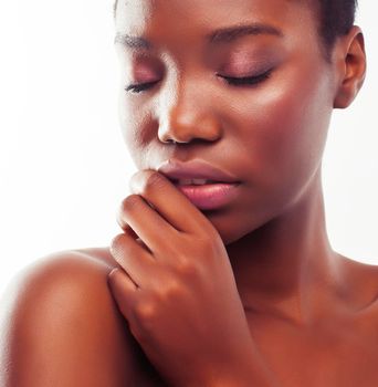 young pretty african american woman naked taking care of her skin isolated on white background, healthcare people concept close up