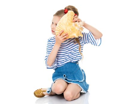 A little girl with a sea shell. The concept of a family vacation at sea, ecology. Isolated on white background.